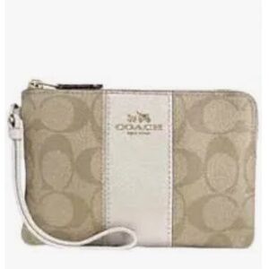 Coach corner wristlet, NWOT. Tan and white